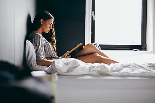 Alone in your bedroom with your favorite books.